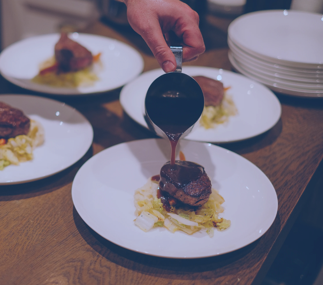 Saucing Steak. Photo Credit William Carmichael