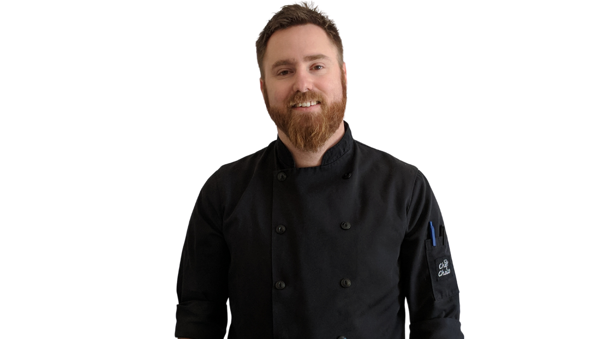 Chef Ben Kelly v2 (1) Chef Ben Kelly in a black chef coat