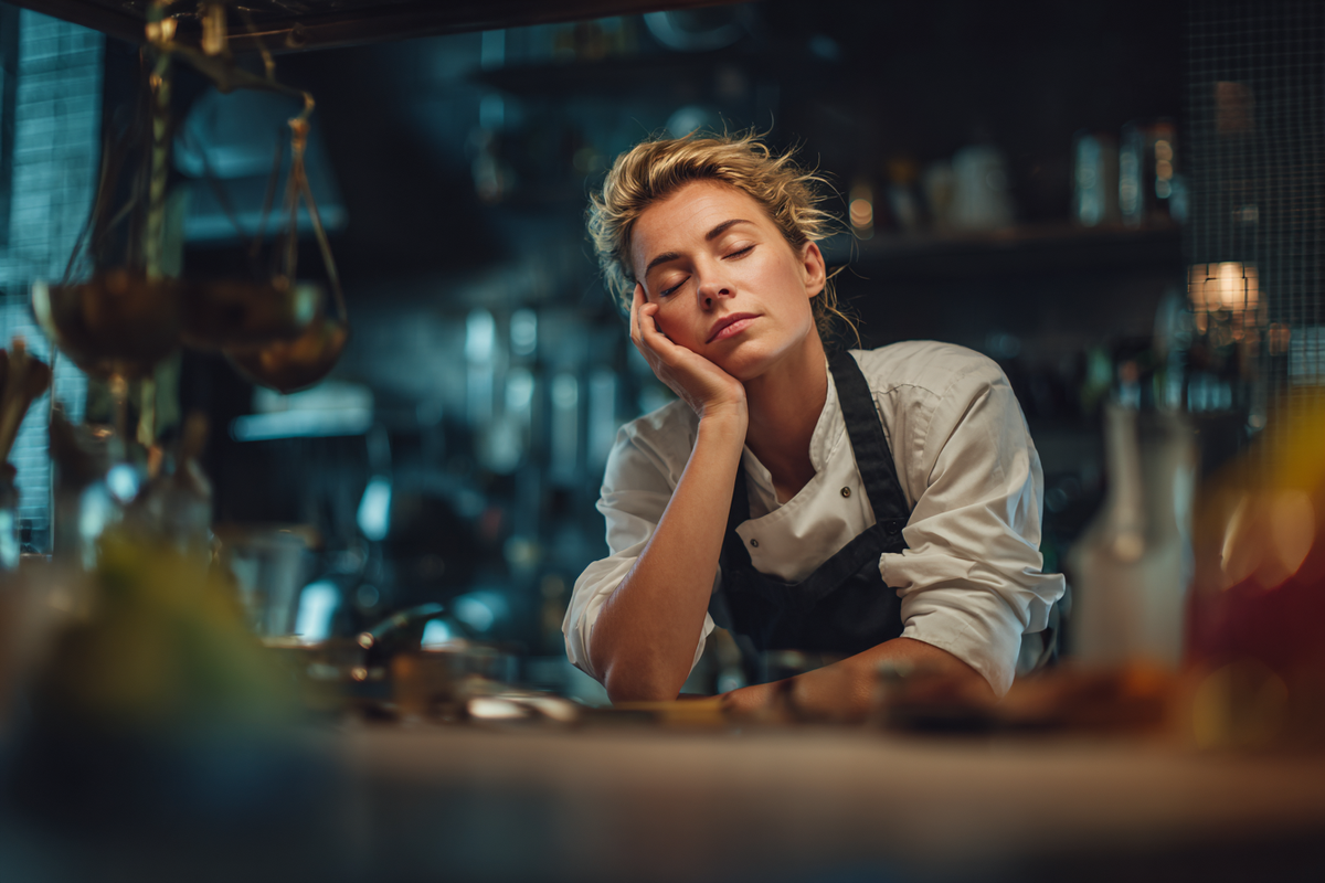 Exhausted_femaleprivate_chef_sitting Exhausted and burnt out private chef